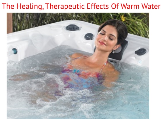 a woman relaxes in a caldera hot tub